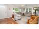 Bright living room with hardwood floors, area rug, and neutral decor at 1006 Home Trl, Gastonia, NC 28052
