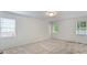 Large bedroom with carpet, plenty of natural light, and neutral color scheme at 1011 Atherstone Nw St, Conover, NC 28613