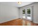Bedroom featuring hardwood floors and sliding glass doors to a deck at 1011 Atherstone Nw St, Conover, NC 28613