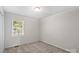 This bedroom is bright and airy with a window bringing in natural light at 1011 Atherstone Nw St, Conover, NC 28613