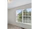 This bright bedroom has a large window with blinds and a view of the outdoors at 1011 Atherstone Nw St, Conover, NC 28613
