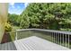 Exterior deck overlooking the lush greenery of the landscaped backyard at 1011 Atherstone Nw St, Conover, NC 28613