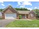 Lovely brick home with an attached garage and green lawn at 1011 Atherstone Nw St, Conover, NC 28613