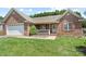 Well-maintained brick home with a manicured lawn and attached two-car garage at 1011 Atherstone Nw St, Conover, NC 28613