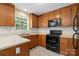 Traditional kitchen with oak cabinets, modern appliances, and ample counter space at 1011 Atherstone Nw St, Conover, NC 28613