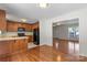 Open concept kitchen with wood cabinets, hardwood floors, and dining area at 1011 Atherstone Nw St, Conover, NC 28613