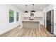 Bright kitchen with stainless steel appliances, a stylish island, and plenty of cabinet space at 1011 Sandy Ct, Gastonia, NC 28056