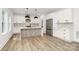 Spacious kitchen features white cabinets, stainless steel appliances, and a central island with seating at 1011 Sandy Ct, Gastonia, NC 28056