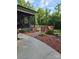 Inviting backyard with wooden deck, screened-in porch, and professionally landscaped features at 103 Northchase Dr, Concord, NC 28027
