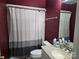 Cozy bathroom featuring a shower with white curtain, vanity with sink, and a decorative mirror at 103 Northchase Dr, Concord, NC 28027