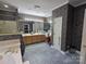 Bathroom featuring dual sinks, ample countertop space, and a large mirror at 103 Northchase Dr, Concord, NC 28027