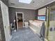 Bathroom featuring a soaking tub with tile surround and shower with glass door at 103 Northchase Dr, Concord, NC 28027
