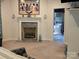 Bedroom with a cozy fireplace and a view of the adjacent bathroom offers relaxation and convenience at 103 Northchase Dr, Concord, NC 28027