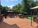 Inviting deck featuring an outdoor dining area, grill, and green space for entertaining guests at 103 Northchase Dr, Concord, NC 28027