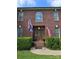 Inviting front entrance featuring a brick facade, decorative door, and manicured shrubbery at 103 Northchase Dr, Concord, NC 28027
