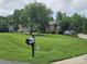 Spacious lot featuring a brick two-story home, well-kept lawn, and mature shade trees at 103 Northchase Dr, Concord, NC 28027