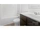 Clean bathroom featuring a shower-tub combo and modern vanity at 10328 Kempsford Dr, Charlotte, NC 28262