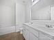 Bathroom featuring double sinks, a large mirror, and modern fixtures at 10328 Kempsford Dr, Charlotte, NC 28262