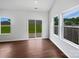 Bright living room with wood floors and sliding door access to outdoor space at 10328 Kempsford Dr, Charlotte, NC 28262