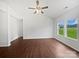 Bright living room with wood floors and large windows offering plenty of natural light at 10328 Kempsford Dr, Charlotte, NC 28262