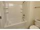 Bathroom features a shower-tub combo with tile surround and chrome fixtures at 11148 Kanturk Ct, Charlotte, NC 28213
