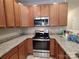 Modern kitchen boasting granite countertops, stainless steel appliances and ample storage space at 11148 Kanturk Ct, Charlotte, NC 28213