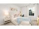 Cozy bedroom with a soft bed, side table, and a large window for natural light at 11209 Cardinal Creek Ave, Charlotte, NC 28215