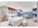Stylish bedroom with vaulted ceilings, and cheerful blue accents at 1220 Elrond Nw Dr, Charlotte, NC 28269