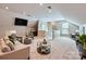 A spacious bonus room featuring large windows, recessed lighting, and seating options at 1220 Elrond Nw Dr, Charlotte, NC 28269