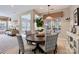 Cozy breakfast nook with a round wooden table, patterned chairs, and natural light at 1220 Elrond Nw Dr, Charlotte, NC 28269
