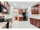Kitchen features stainless steel appliances, dark cabinetry, and an open layout at 1220 Elrond Nw Dr, Charlotte, NC 28269