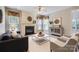 Cozy living room features a fireplace, built-in shelving, and neutral decor at 1220 Elrond Nw Dr, Charlotte, NC 28269