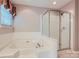 Relaxing bathroom featuring a soaking tub, and glass enclosed shower at 1220 Elrond Nw Dr, Charlotte, NC 28269