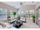 Bright sun room features large windows and tile flooring at 1220 Elrond Nw Dr, Charlotte, NC 28269