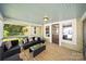 Cozy back porch with comfortable seating, ideal for outdoor relaxation and entertaining at 124 Marion St, Clover, SC 29710
