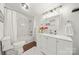 Well-lit bathroom featuring a shower/tub combo, white vanity, and wood-look floors at 124 Marion St, Clover, SC 29710