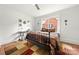 Comfortable bedroom has a large window, decor, and a unique decorative carpet at 124 Marion St, Clover, SC 29710