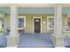 Covered porch with seating and a swing; Craftsman style home with new paint and fixtures at 124 Marion St, Clover, SC 29710