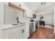 Well-designed kitchen featuring white cabinets, modern appliances, and hardwood floors at 124 Marion St, Clover, SC 29710