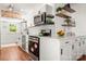 Bright, modern kitchen with stainless steel appliances, white cabinets, and hardwood floors at 124 Marion St, Clover, SC 29710