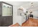 Connected kitchen to dining room features white cabinets, hardwood floors, stainless appliances at 124 Marion St, Clover, SC 29710