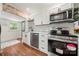 Updated kitchen with white cabinets, stainless steel appliances, and stylish backsplash at 124 Marion St, Clover, SC 29710