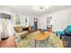 Inviting living room showcasing hardwood floors, neutral walls, and lots of natural light at 124 Marion St, Clover, SC 29710