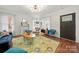 Bright living room with hardwood floors, fireplace, and a decorative coffered ceiling at 124 Marion St, Clover, SC 29710