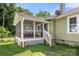 View of a screened porch with outdoor seating; steps leading to backyard at 124 Marion St, Clover, SC 29710