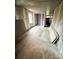 Another view of the unfinished living room showcasing the space and light available for renovation at 129 Williams Rd, Bessemer City, NC 28016