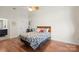 Bright bedroom showcasing hardwood floors, a ceiling fan, and ample space at 1315 East Blvd # 203, Charlotte, NC 28203