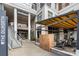 Exterior daytime view of The Dilworth entrance with outdoor seating at 1315 East Blvd # 203, Charlotte, NC 28203
