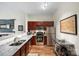 Well-lit kitchen featuring stainless steel appliances, granite countertops, and modern fixtures at 1315 East Blvd # 203, Charlotte, NC 28203