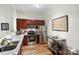 Well-lit kitchen featuring stainless steel appliances, granite countertops, and modern fixtures at 1315 East Blvd # 203, Charlotte, NC 28203